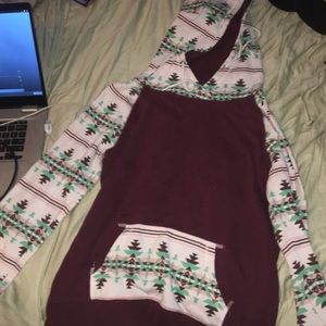 A large Burgundy sweatshirt in the size large